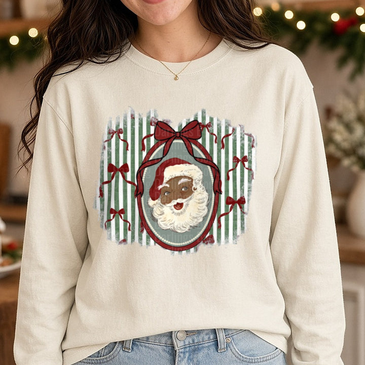 Black Santa Vintage Oval Frame Green Stripes Bows DTF transfer shown on a Comfort Colors long sleeve tee