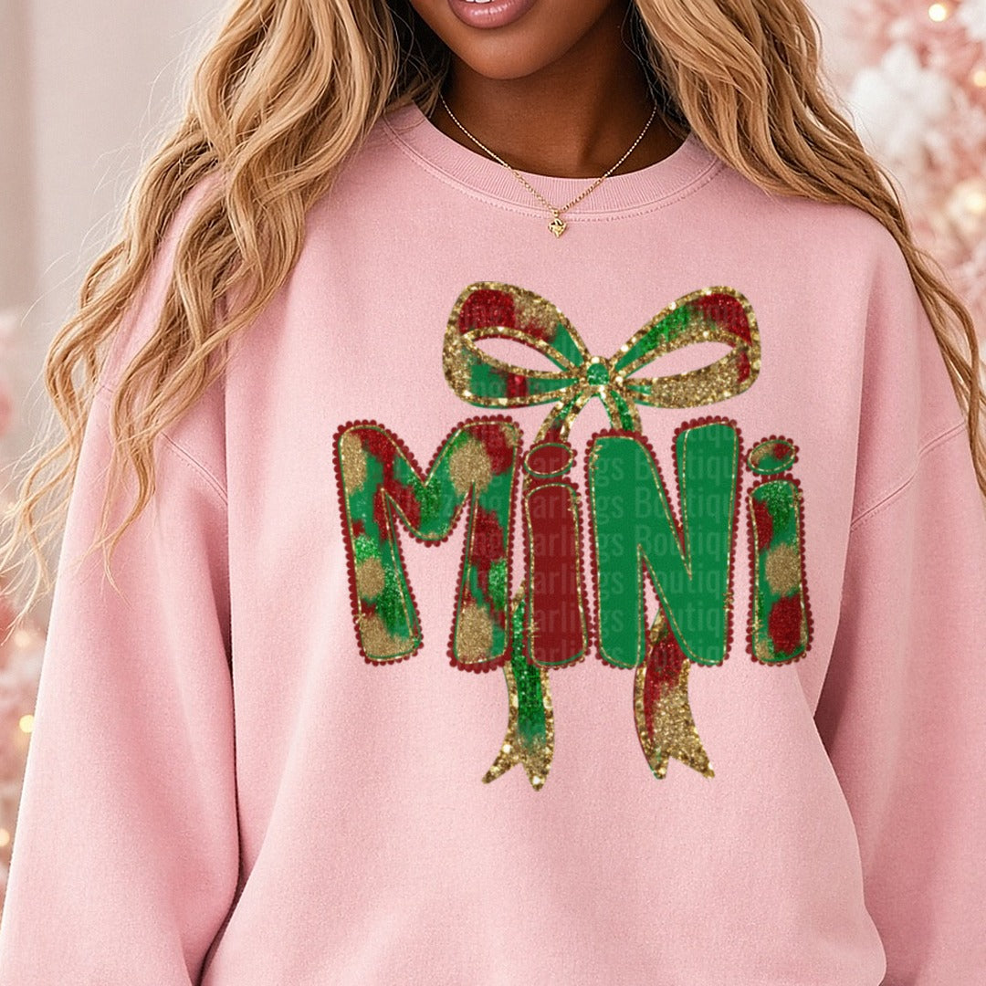 Mini Christmas Glitter Bow Plaid Letters DTF transfer shown on a Comfort Colors sweatshirt