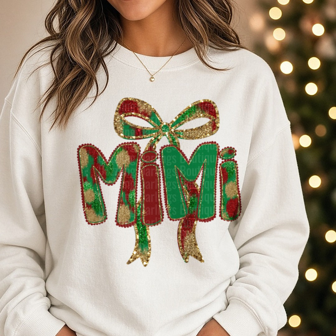 Mimi Christmas Glitter Bow Plaid Letters DTF transfer shown on a Comfort Colors sweatshirt