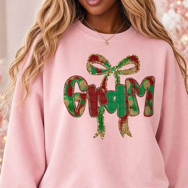 Gram Christmas Glitter Bow Plaid Letters DTF transfer shown on a Comfort Colors sweatshirt
