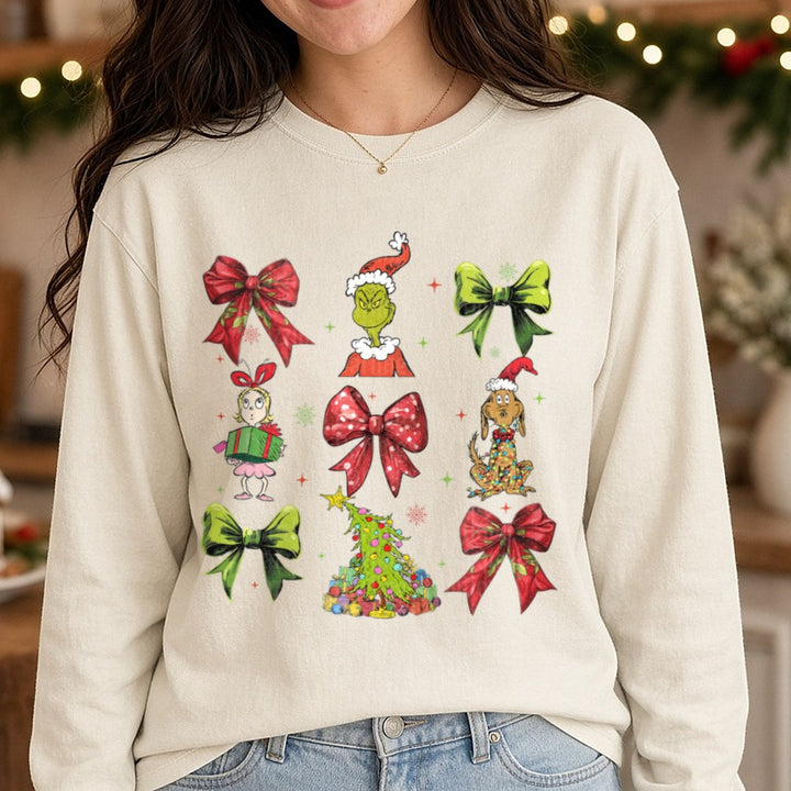 grinch bow collage DTF transfer shown on a Comfort Colors long sleeve tee