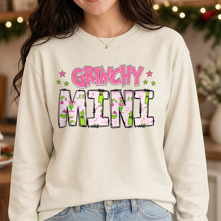 Grinchy Mini Pink Patterned Letters Stars DTF transfer shown on a Comfort Colors long sleeve tee
