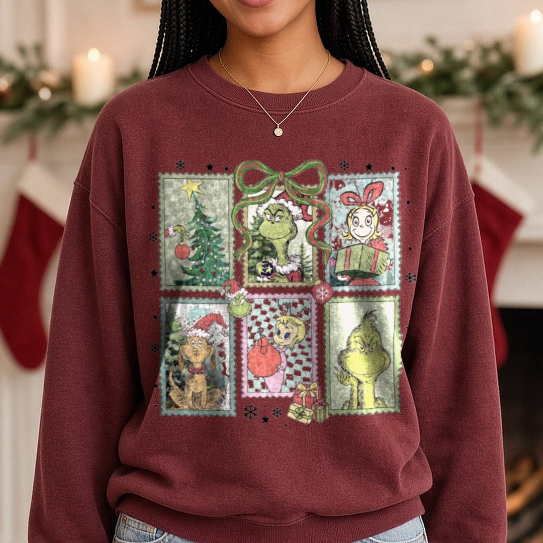 grinch stamps DTF transfer shown on a Comfort Colors sweatshirt