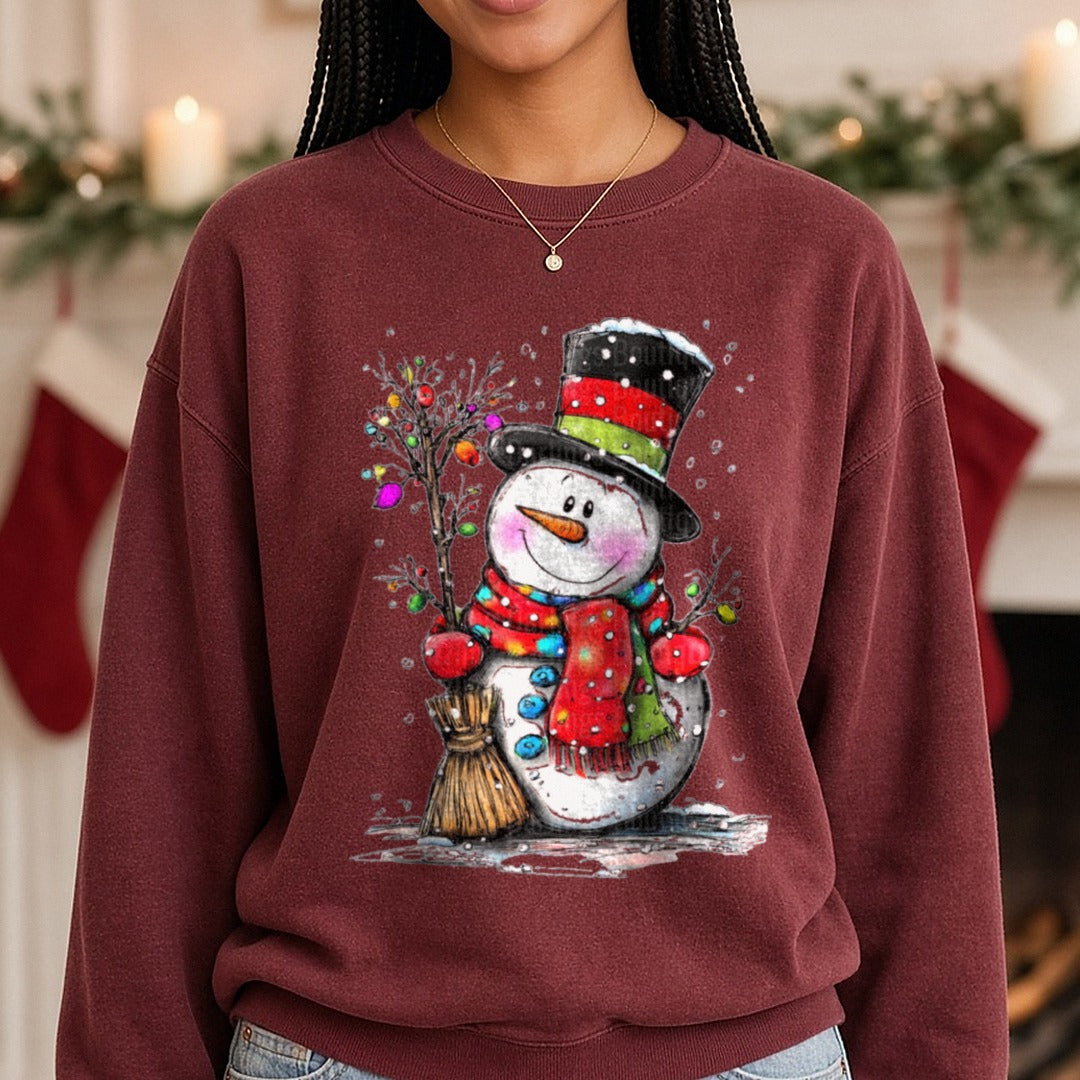 Hand-drawn Snowman Christmas Lights Branch DTF transfer shown on a Comfort Colors sweatshirt