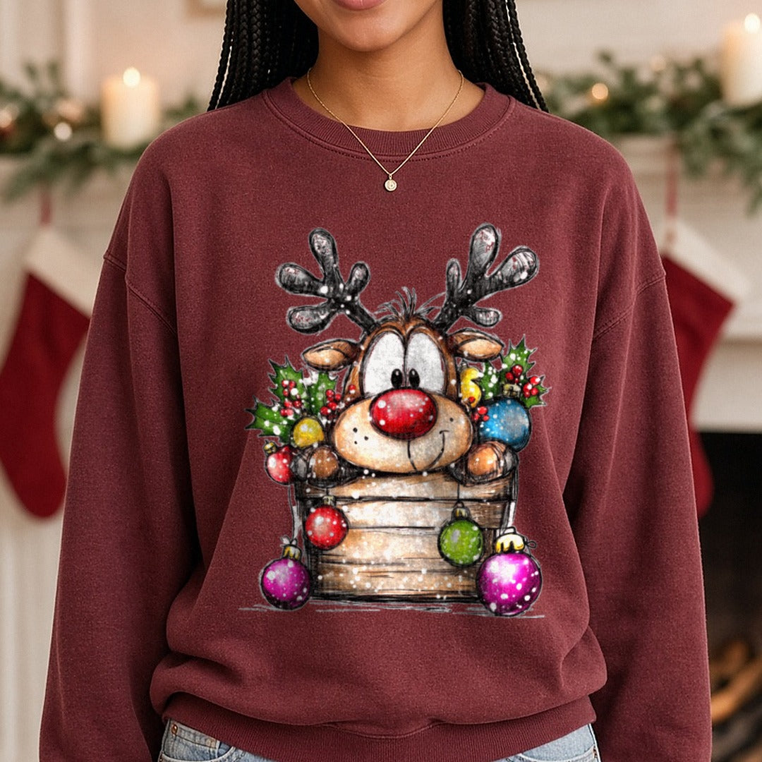 Hand-drawn Christmas Reindeer Bucket DTF transfer shown on a Comfort Colors sweatshirt