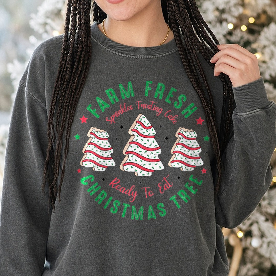 Farm Fresh Christmas Tree Cakes (Distressed) DTF transfer shown on a Comfort Colors sweatshirt
