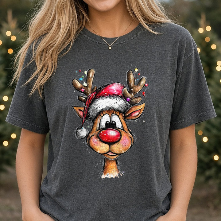Hand-drawn Christmas Reindeer Santa Hat Smiling Portrait DTF transfer shown on a Comfort Colors tee