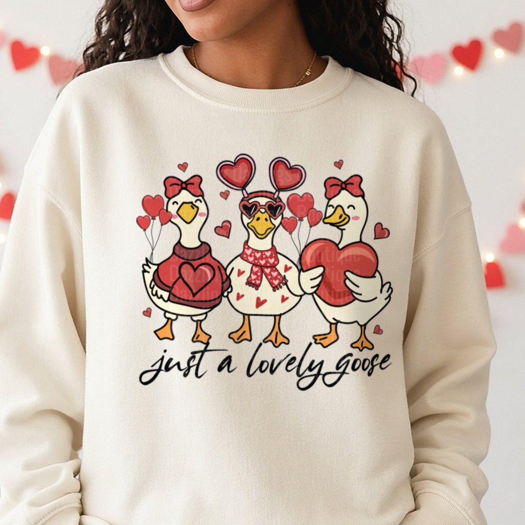 Just a Lovely Goose Cute Lovely Goose Coquette Duck Valentine DTF transfer shown on a Comfort Colors sweatshirt