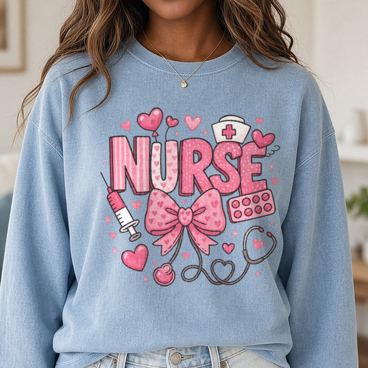 Pink Nurse Bow Stethoscope Valentines Day DTF transfer shown on a Comfort Colors sweatshirt