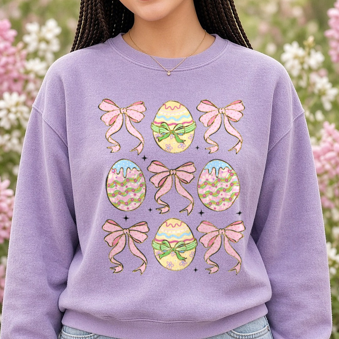 Glitter Easter Eggs Coquette DTF transfer shown on a Comfort Colors sweatshirt