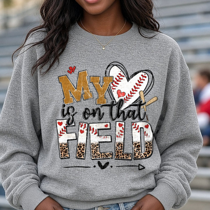 My Heart is on that Field Baseball Mom Design with Leopard Print DTF transfer shown on a Comfort Colors sweatshirt