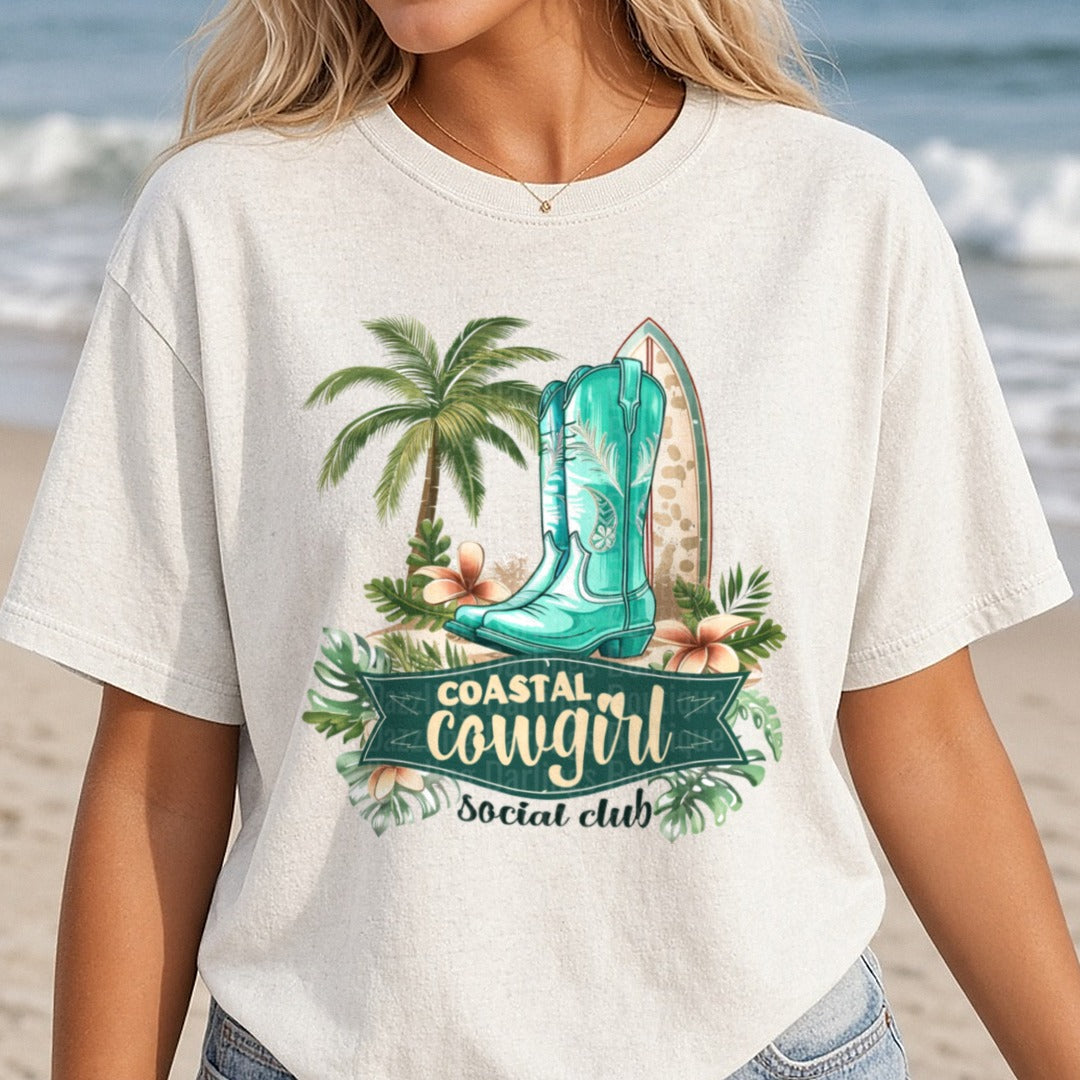 Coastal Cowgirl Social Club Turquoise Boots Palm Trees Surfboard DTF transfer shown on a Comfort Colors tee