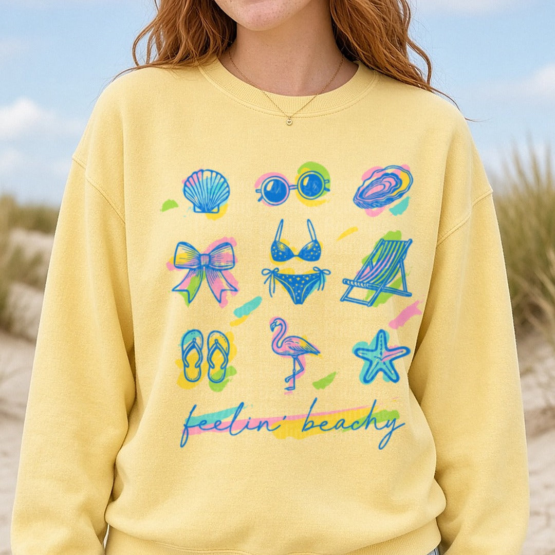 Feelin Beachy Summer Vibes Collection with Seashells Bikini Flamingo and Beach Chair DTF transfer shown on a Comfort Colors sweatshirt