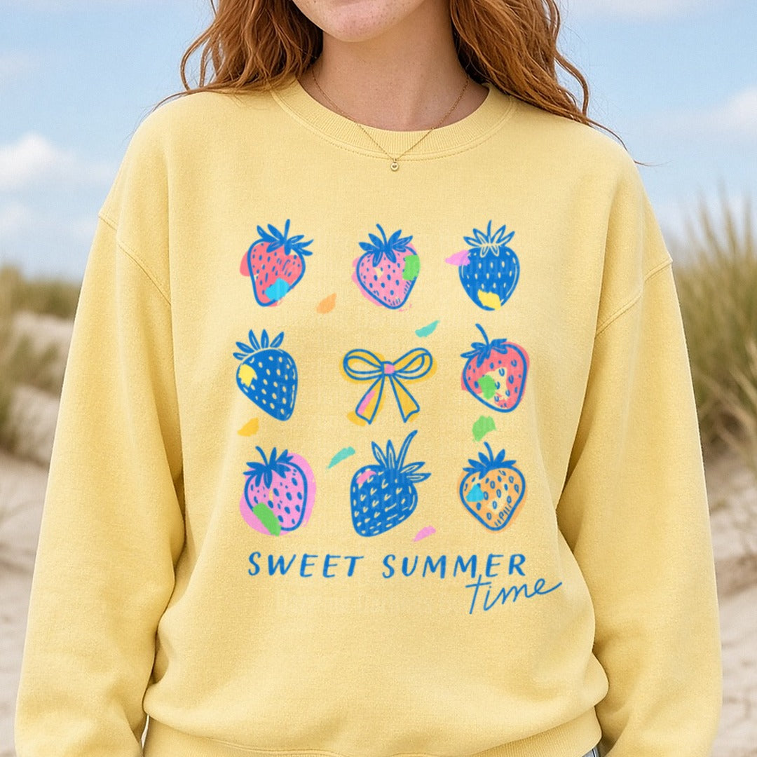 Sweet Summer Time Colorful Strawberries and Bow Design DTF transfer shown on a Comfort Colors sweatshirt
