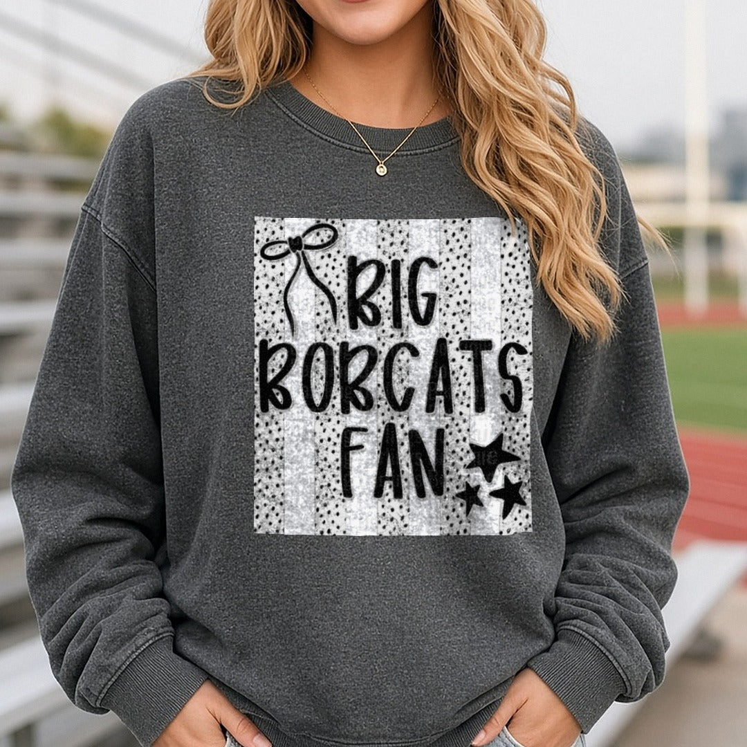Big Bobcats Fan Typography with Bow and Stars on Polka Dots DTF transfer shown on a Comfort Colors sweatshirt