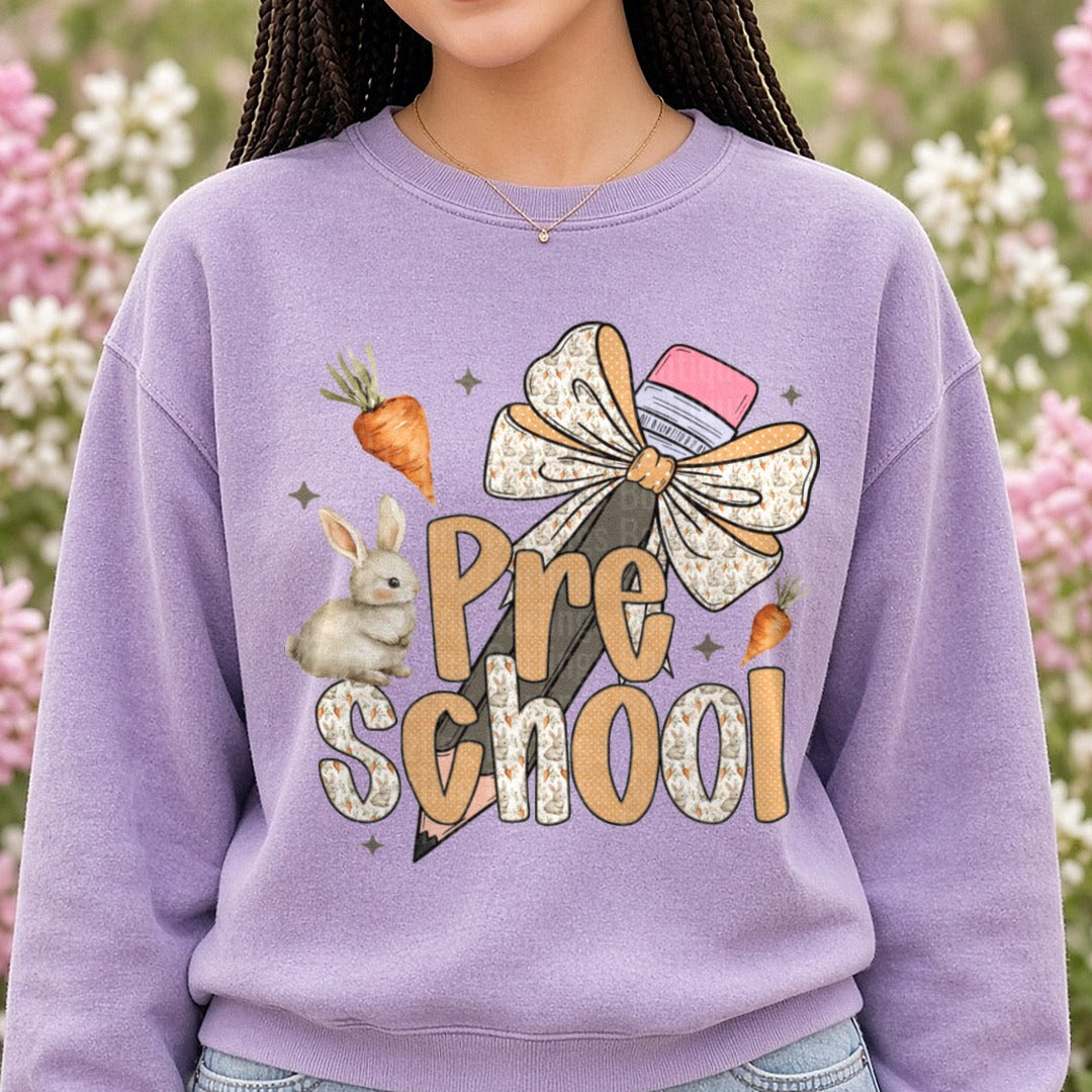 Pre School Bunny Rabbit Bow Pencil Carrots Design DTF transfer shown on a Comfort Colors sweatshirt
