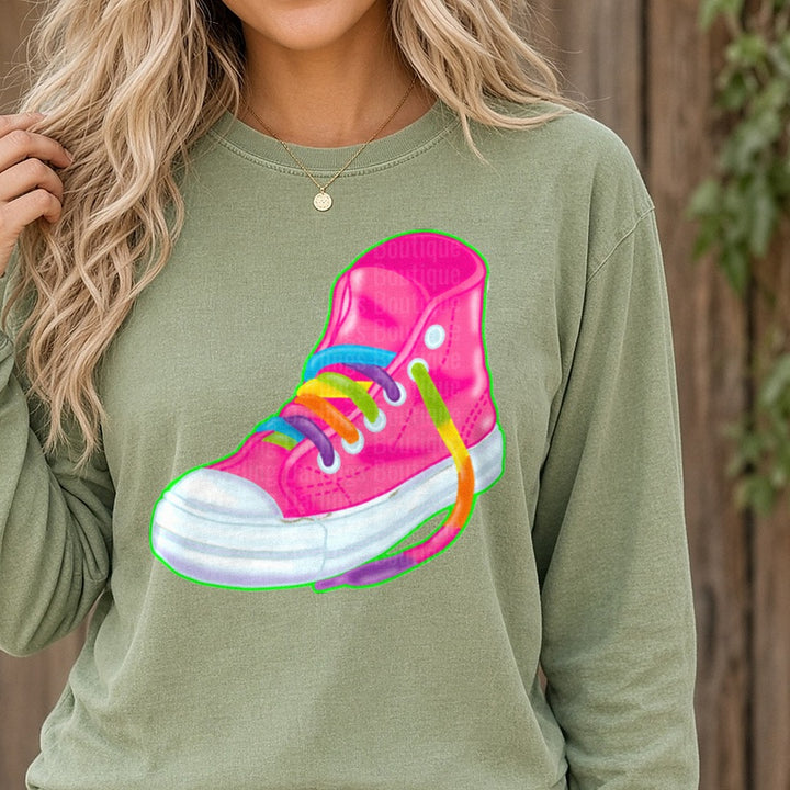 Pink High-Top Sneaker with Rainbow Shoelaces DTF transfer shown on a Comfort Colors long sleeve tee