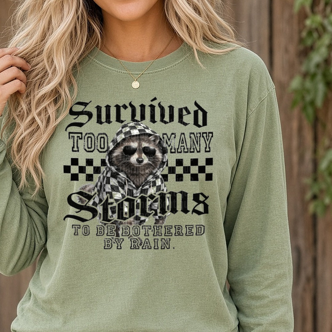 Sloth in Checkered Hoodie Sunglasses Survived Too Many Sloths to Be Bothered by Rain DTF transfer shown on a Comfort Colors long sleeve tee