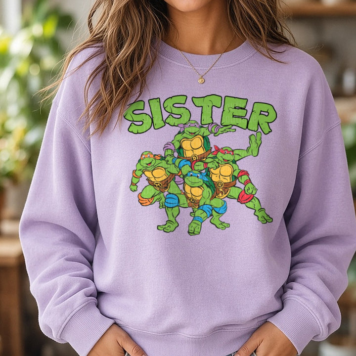 Teenage Mutant Ninja Turtles Sister Group Portrait DTF transfer shown on a Comfort Colors sweatshirt