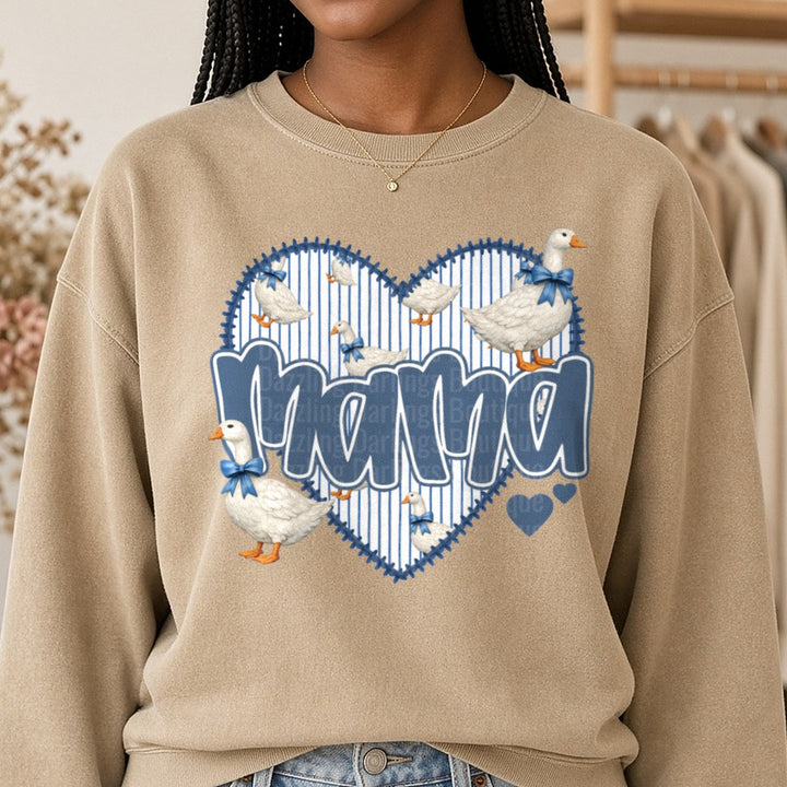 Mama Geese with Blue Bows Heart Frame Design DTF transfer shown on a Comfort Colors sweatshirt