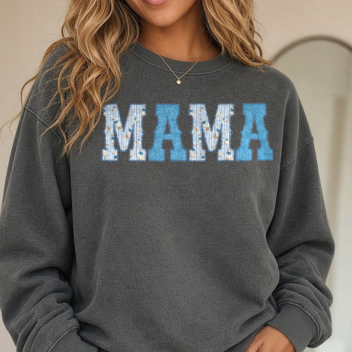 MAMA Letters with Blue Polka Dots and Stork Pattern DTF transfer shown on a Comfort Colors sweatshirt
