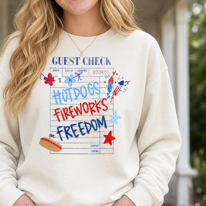 Patriotic Restaurant Guest Check Hot Dogs Fireworks Freedom DTF transfer shown on a Comfort Colors sweatshirt