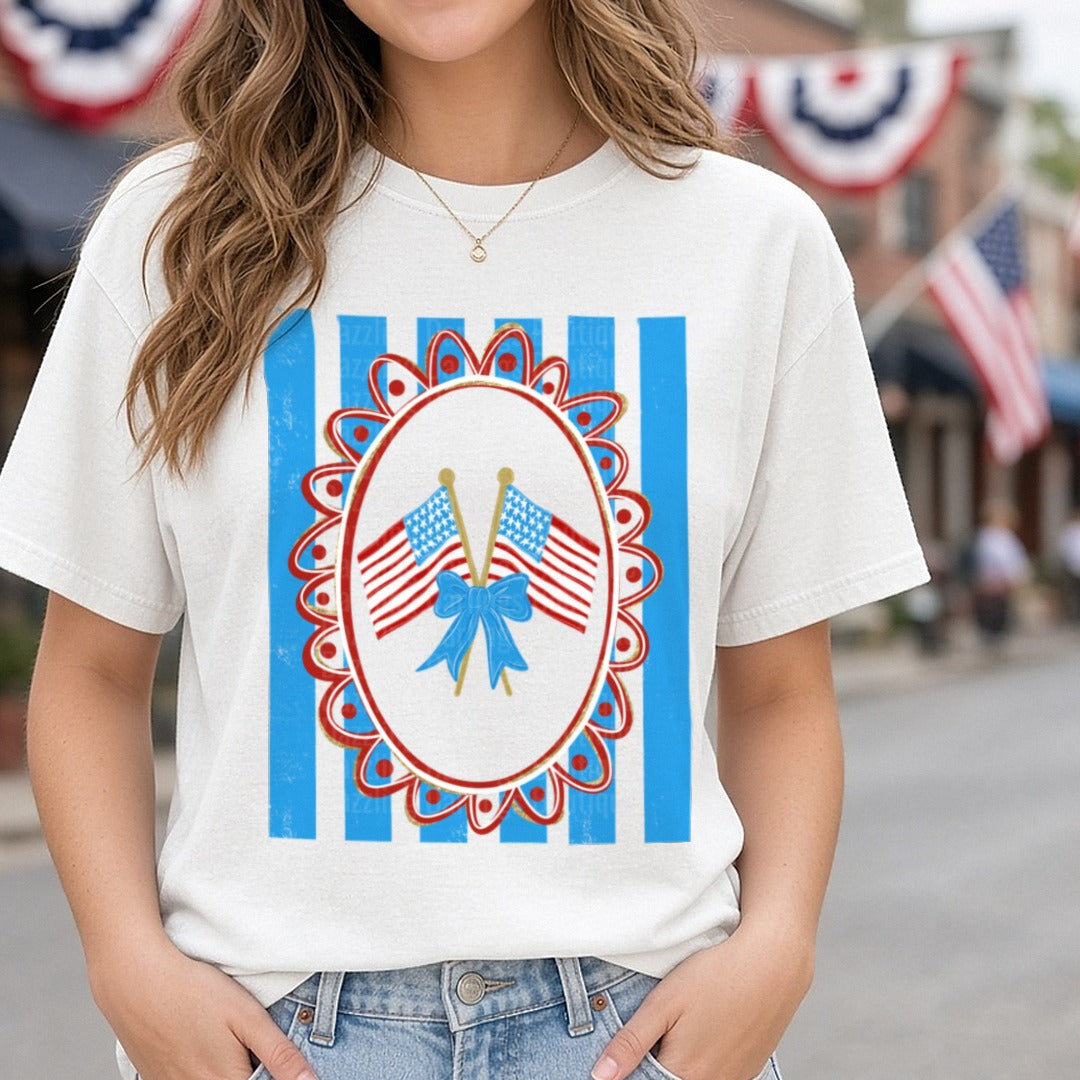 Patriotic American Flags with Blue Bow Decorative Frame DTF transfer shown on a Comfort Colors tee