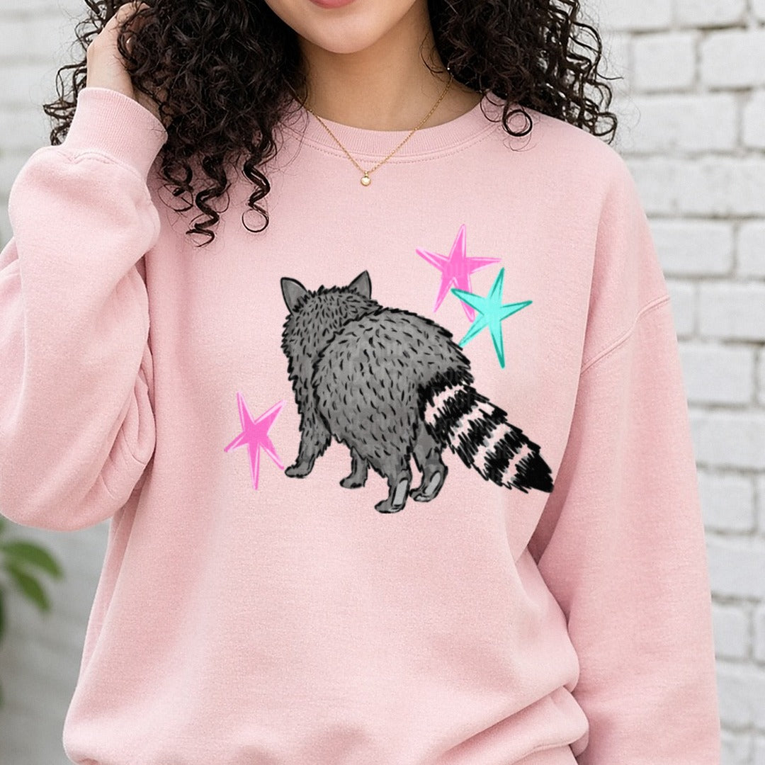 Fluffy Raccoon with Colorful Stars Illustration DTF transfer shown on a Comfort Colors sweatshirt