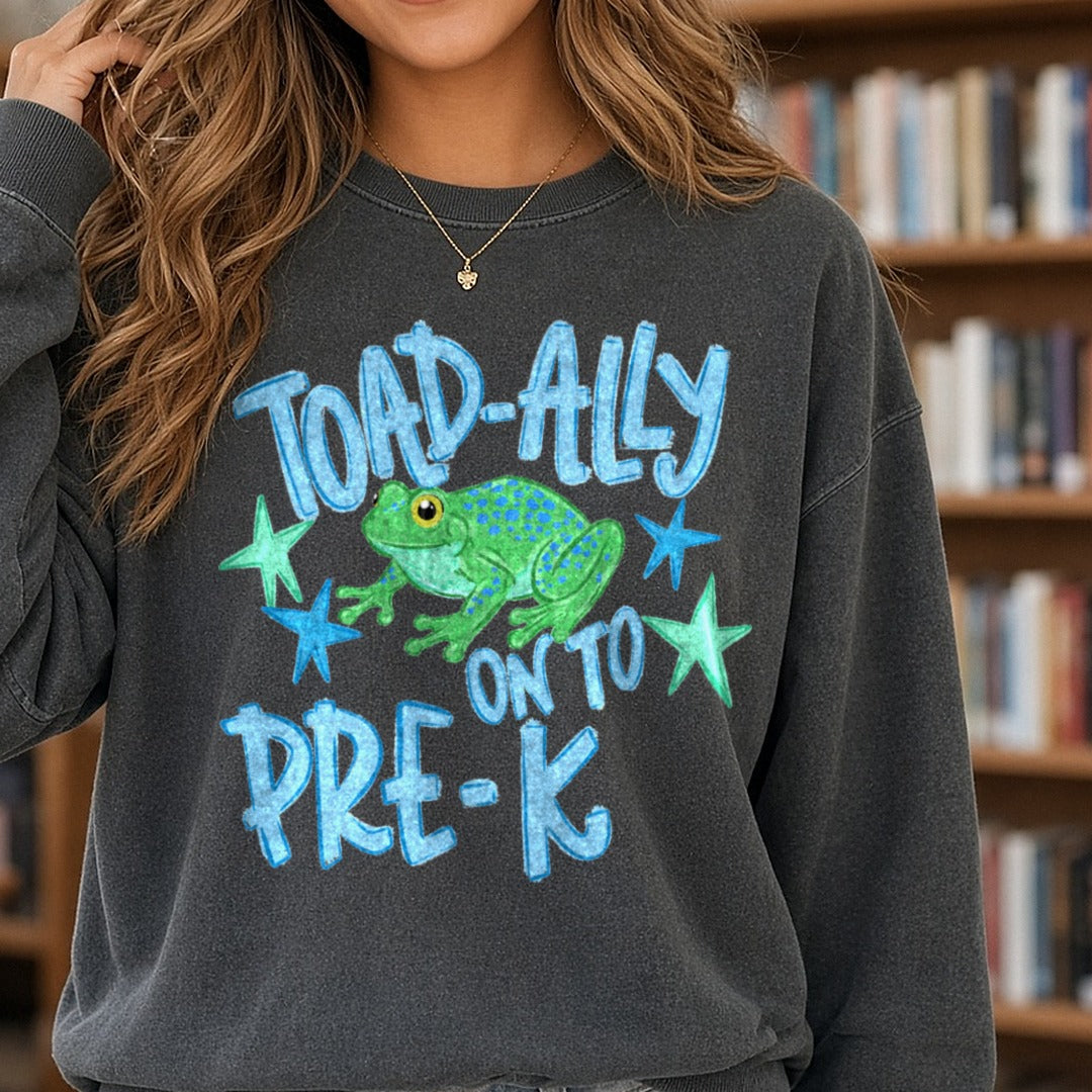 Toad-ally Onto Pre-K Cute Frog Back to School Design DTF transfer shown on a Comfort Colors sweatshirt