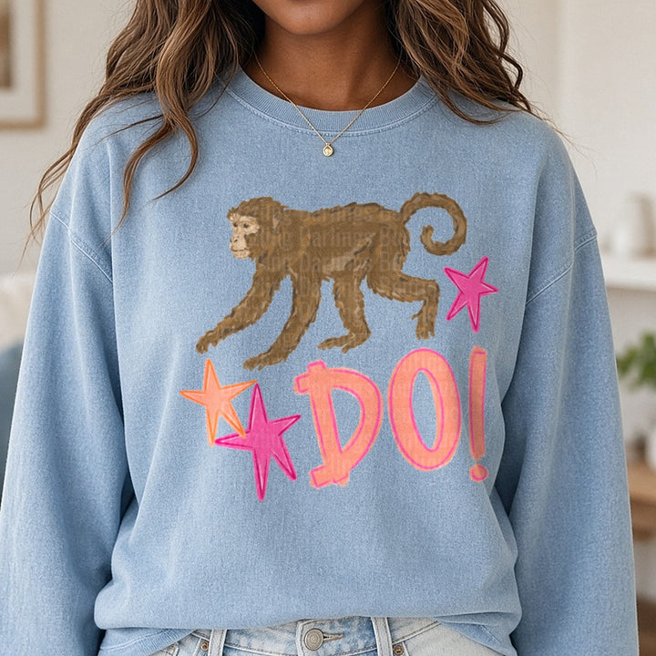 Brown Monkey with Pink and Orange Stars DO! Text Design DTF transfer shown on a Comfort Colors sweatshirt