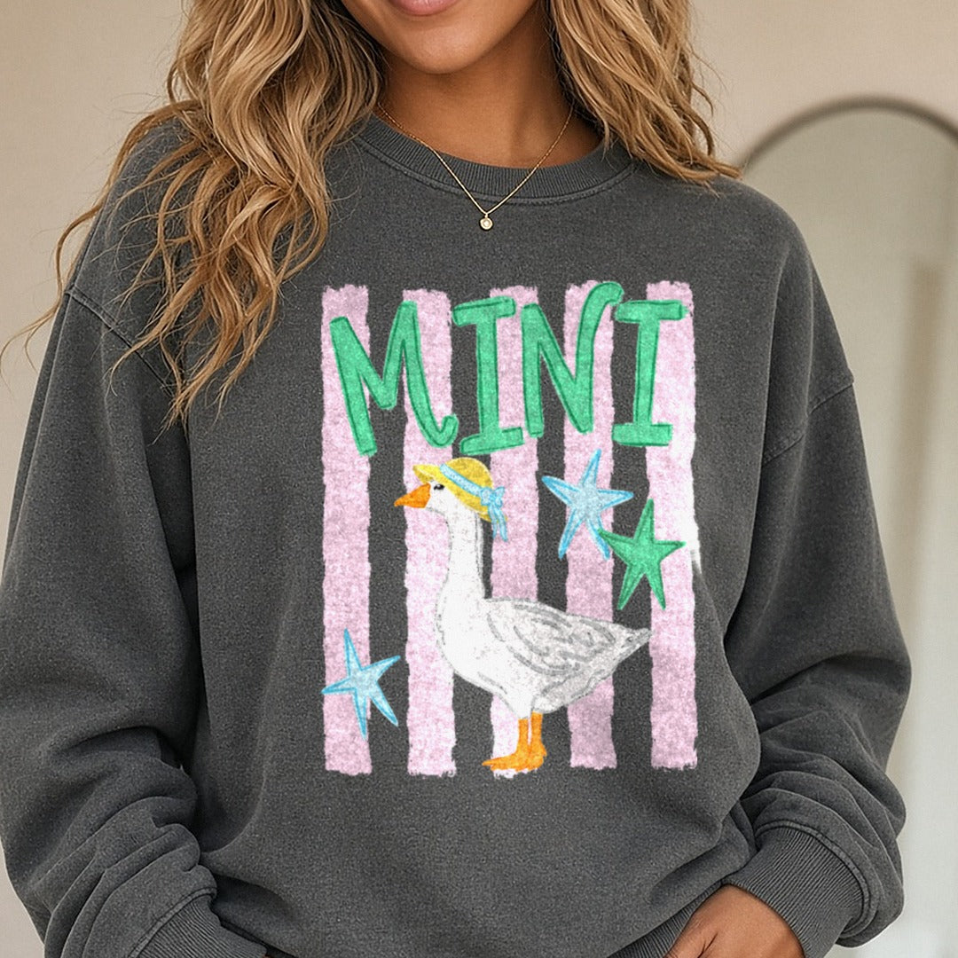 Mini Seagull with Yellow Hat and Stars Pink Stripes DTF transfer shown on a Comfort Colors sweatshirt