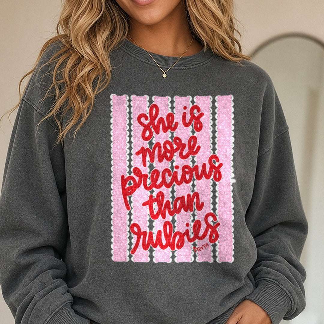 She Is More Precious Than Rubies Proverbs 31:6 Script Lettering DTF transfer shown on a Comfort Colors sweatshirt
