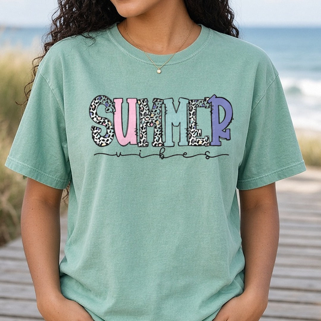 Summer Vibes Leopard Print Text with Pastel Colors DTF transfer shown on a Comfort Colors tee