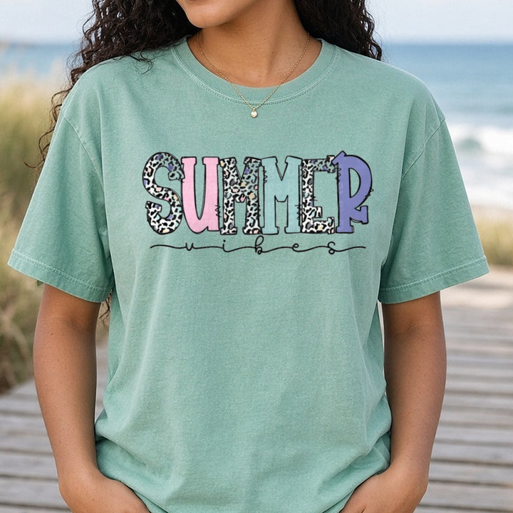 Summer Vibes Leopard Print Text with Pastel Colors DTF transfer shown on a Comfort Colors tee