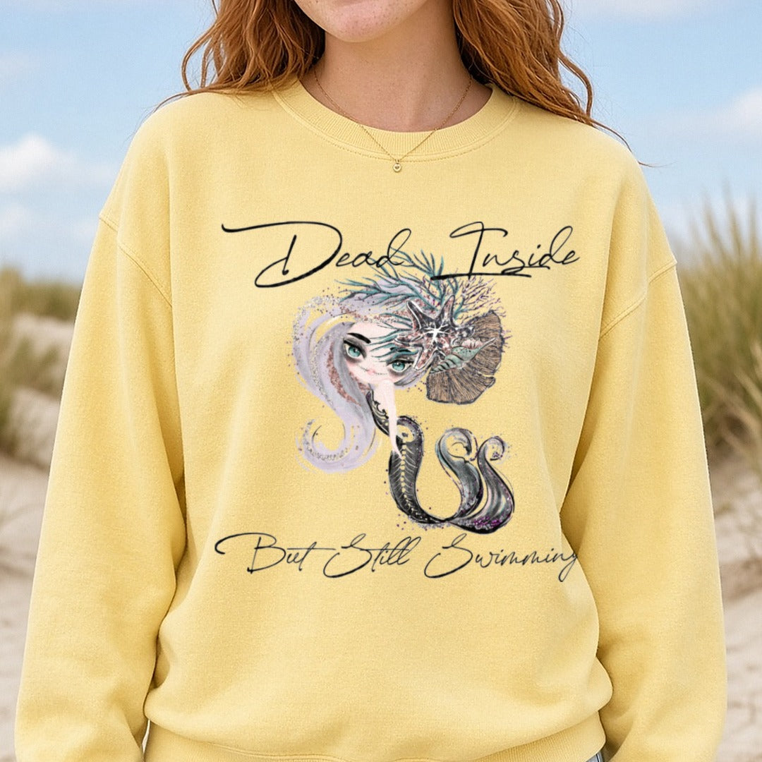 Dead Inside But Still Swimming Mermaid with Sea Life Crown DTF transfer shown on a Comfort Colors sweatshirt