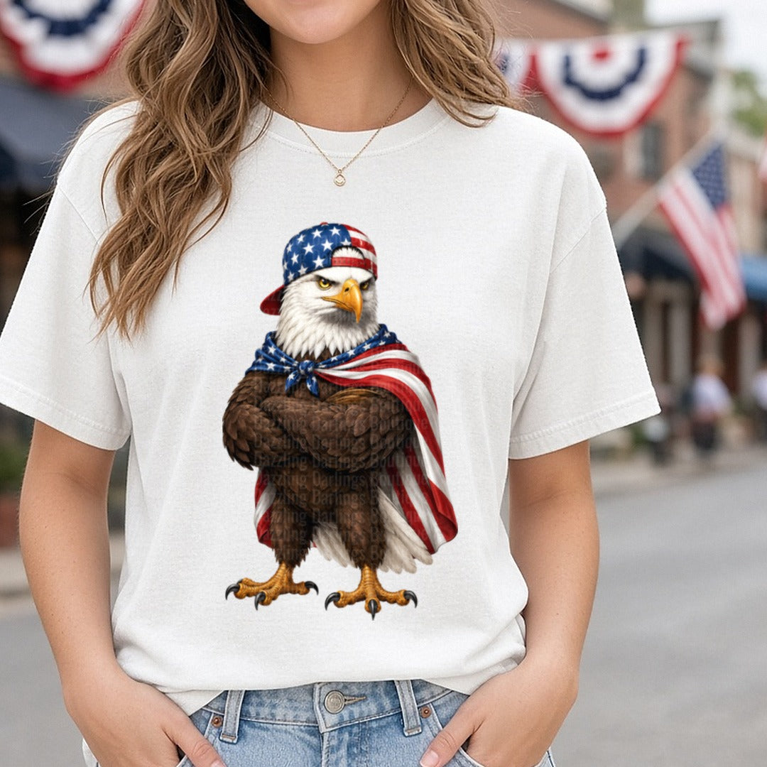Patriotic Bald Eagle Wearing American Flag Baseball Cap and Cape DTF transfer shown on a Comfort Colors tee