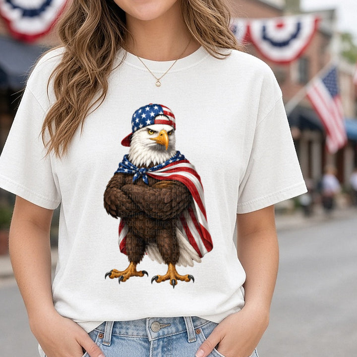 Patriotic Bald Eagle Wearing American Flag Baseball Cap and Cape DTF transfer shown on a Comfort Colors tee
