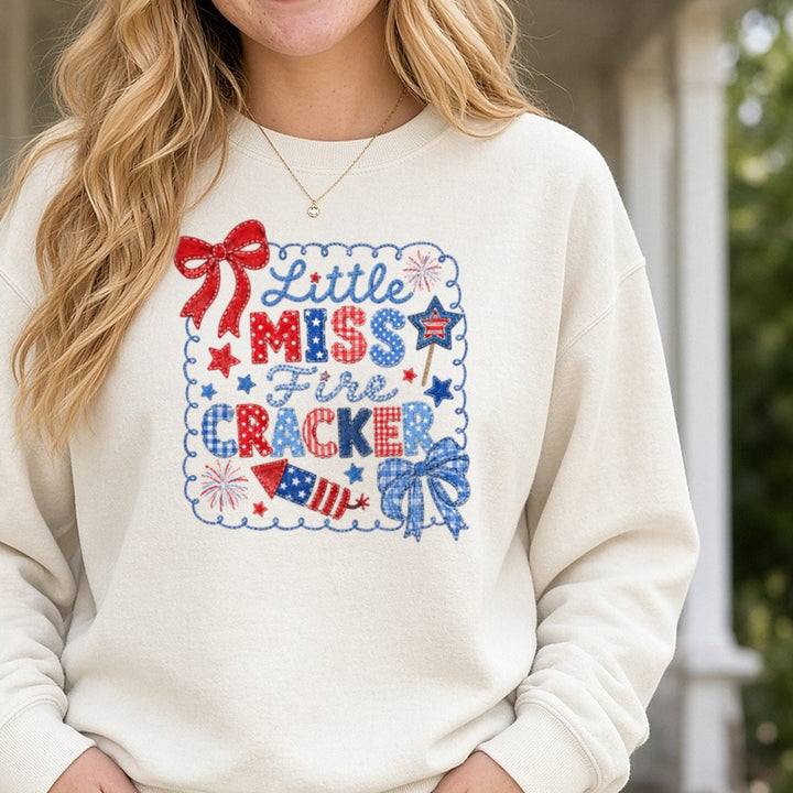 Little Miss Firecracker Patriotic Embroidery Style Fourth of July DTF transfer shown on a Comfort Colors sweatshirt