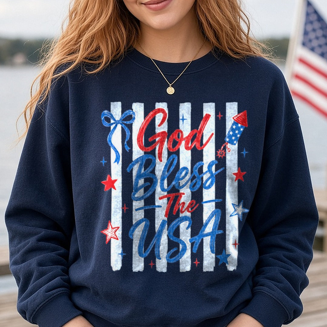 God Bless The USA Patriotic Stars Stripes Bow Firework DTF transfer shown on a Comfort Colors sweatshirt