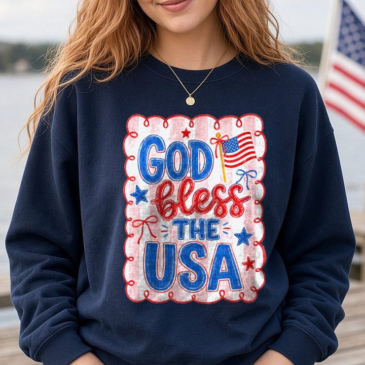 God Bless The USA Patriotic Red White Blue American Flag DTF transfer shown on a Comfort Colors sweatshirt