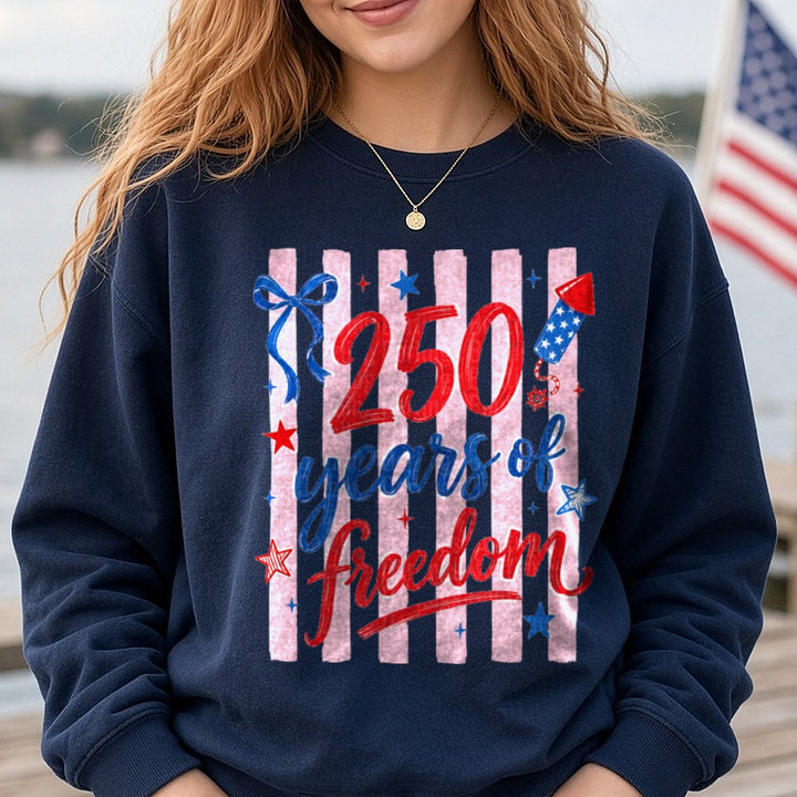 250 Years of Freedom Patriotic Red White Blue Stars Bow DTF transfer shown on a Comfort Colors sweatshirt