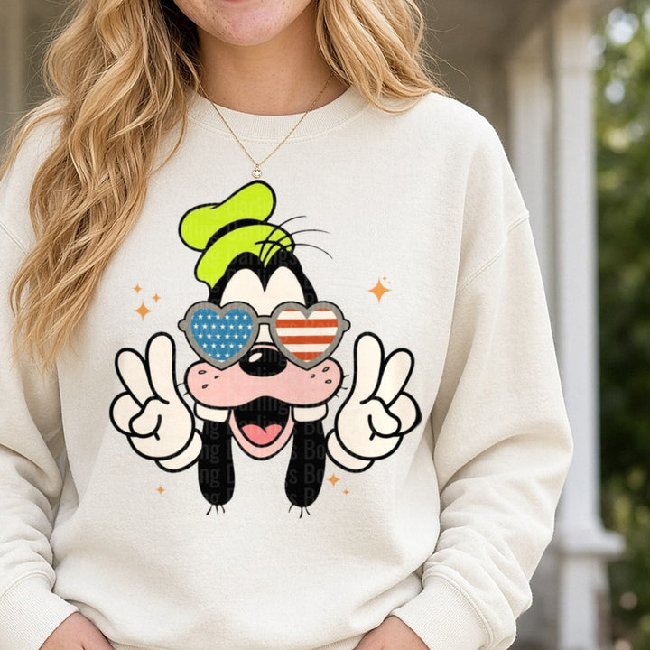 Goofy Patriotic Heart Sunglasses Peace Signs 4th of July DTF transfer shown on a Comfort Colors sweatshirt