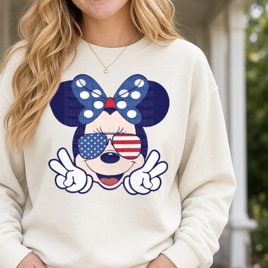 Patriotic Minnie Mouse American Flag Aviators Peace Signs DTF transfer shown on a Comfort Colors sweatshirt