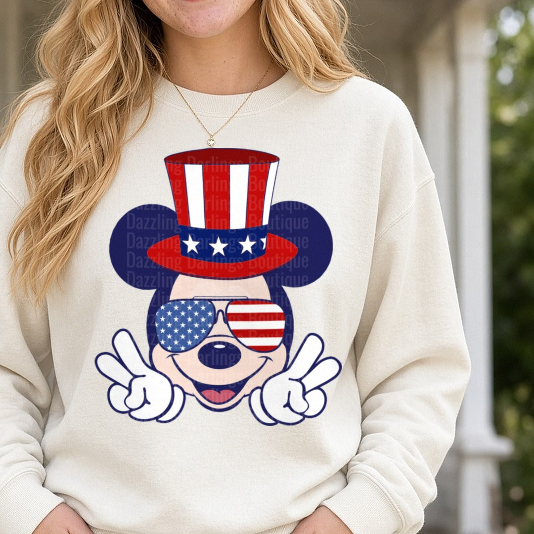 Patriotic Mickey Mouse Uncle Sam Hat American Flag Sunglasses Peace Signs DTF transfer shown on a Comfort Colors sweatshirt