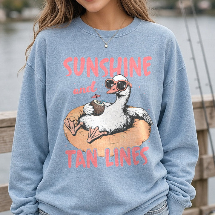 Sunshine and Tan Lines Duck Floating on Pool Ring with Coconut Drink DTF transfer shown on a Comfort Colors sweatshirt