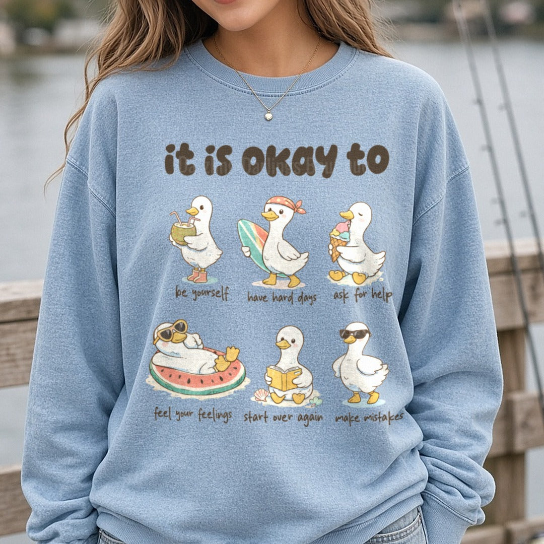 It Is Okay To Cute Duck Mental Health Affirmations Design DTF transfer shown on a Comfort Colors sweatshirt
