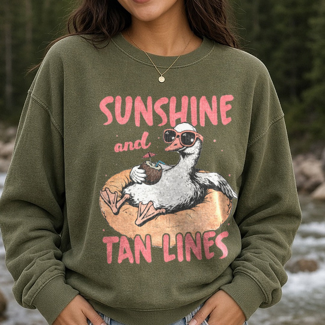 Sunshine and Tan Lines Duck Floating on Pool Ring with Coconut Drink DTF transfer shown on a Comfort Colors sweatshirt
