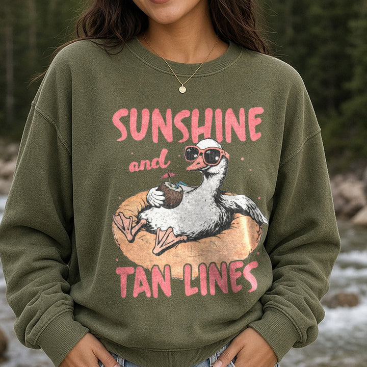 Sunshine and Tan Lines Duck Floating on Pool Ring with Coconut Drink DTF transfer shown on a Comfort Colors sweatshirt