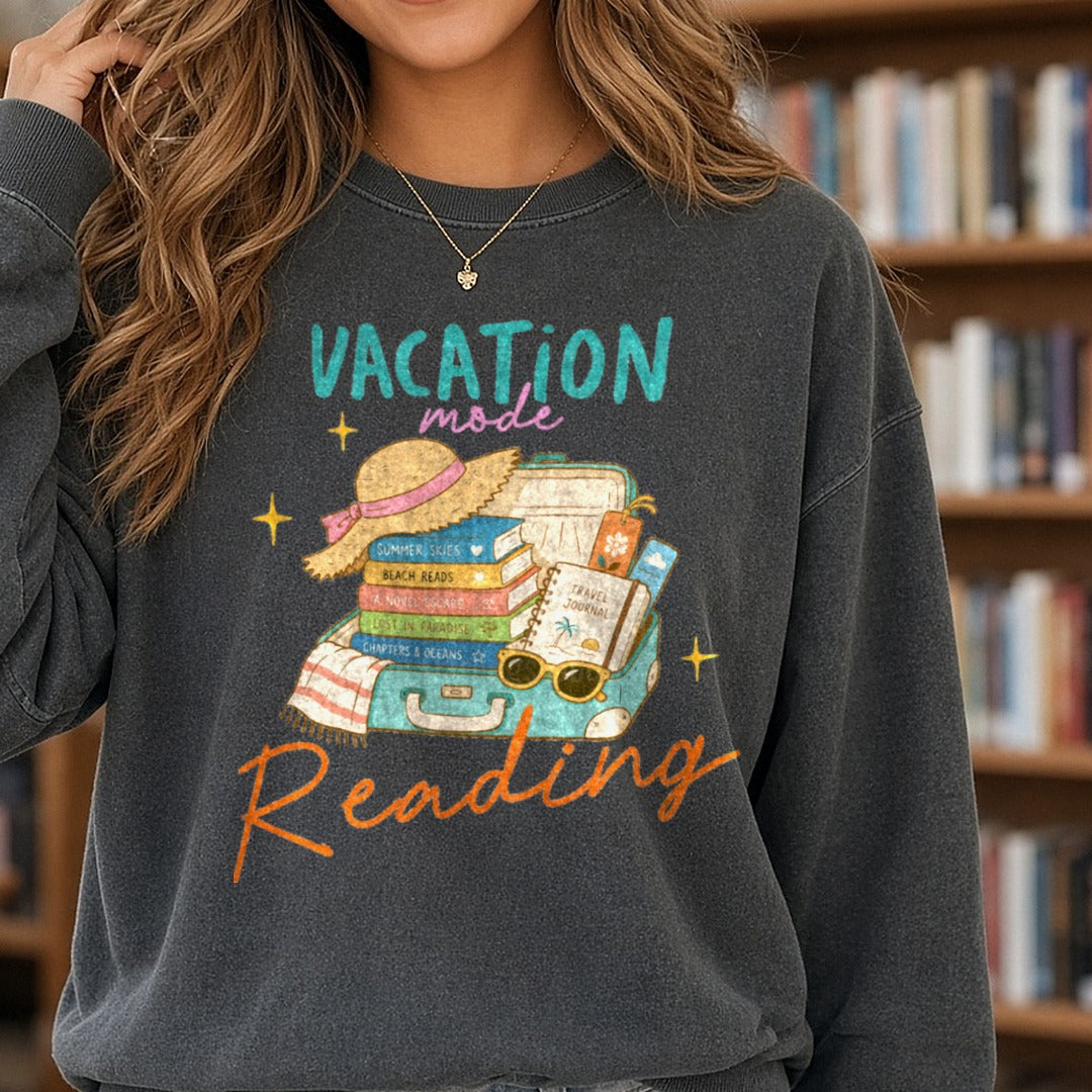 Vacation Mode Reading Open Suitcase Books Beach Hat DTF transfer shown on a Comfort Colors sweatshirt