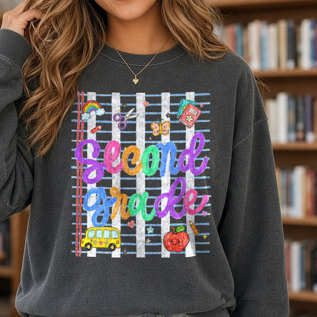 Second Grade Rainbow School Doodles Back to School Design DTF transfer shown on a Comfort Colors sweatshirt